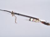 an old wooden stick with a stick handle and a stick holder on it