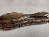 a silver spoon and a silver spoon on a white cloth