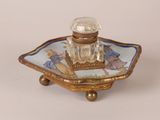 a small glass bottle sitting on top of a tray