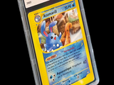 a pokemon card in a plastic case on a black background