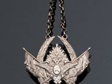 an image of a silver necklace with a blue stone in the middle of it