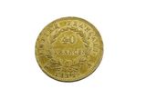 a close up of a gold coin on a white background