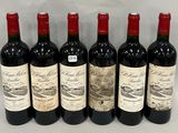 six bottles of red wine lined up in a row