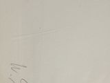 someone is writing on a piece of paper with a pencil
