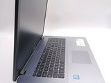 a laptop that is open on a white surface