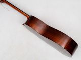 a close up of a wooden instrument on a white surface