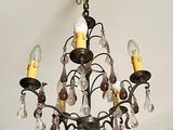 a chandelier that is hanging from the ceiling in the room