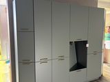 an image of a kitchen with cabinets and a stove