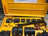 a yellow case that has a bunch of electrical equipment in it