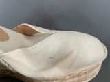 an image of a pair of white shoes with a tan sole