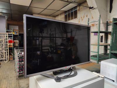 a television sitting on top of a table in a room