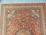 an oriental rug on a blue floor in a room