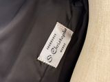 a close up of a label on a black jacket