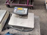 a scale sitting on top of a table next to other items