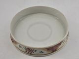 a white bowl with a dragon design on it