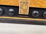 an old fashioned radio that is on display in the room