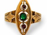 an image of a gold ring with a green and red stone