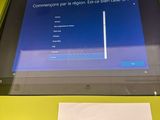 a sign that says 1 on the screen in front of a monitor