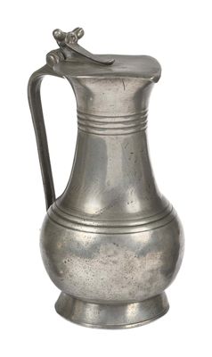 a silver pitcher with a handle on a white background