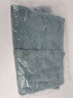 a piece of blue cloth wrapped in plastic on a white surface