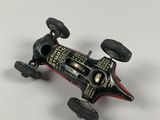 an image of a toy racing car on a white surface