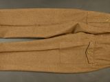 pair of brown wool pants with buttons and zippers on them