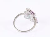 an image of a pink and white diamond ring on a white background
