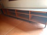 a bed that is sitting on a shelf in a room