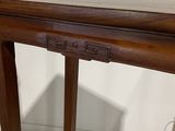 a wooden table with a drawer on top of it