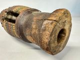an old wooden object that is sitting on a table