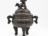 chinese bronze censement with a dog on top of it