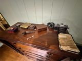 a desk with a bunch of items on top of it