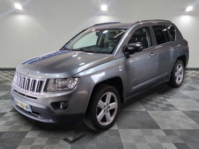 a picture of a jeep compass parked on a checkered floor
