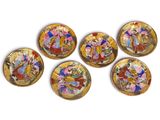 six small plates with a painting on them are sitting on a white surface