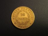 a gold coin with the number twenty on it