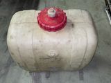 a red fire hydrant sitting on top of a cement block