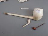 a pipe and a pipe holder on a table