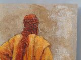 an oil painting of a man in a yellow robe standing in front of a white wall