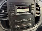 a car dashboard with a radio and a steering wheel