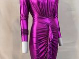 a mannequine wearing a purple dress with long sleeves