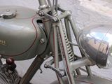 a close up of a motorcycle parked on the side of the street