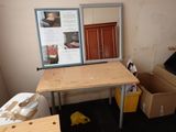 a desk with a mirror on top of it in a room