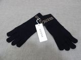 black gloves with a tag that says guess on it