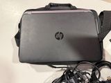 a laptop and a charger sitting on a table