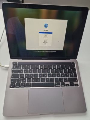 an open laptop computer sitting on top of a desk next to a mouse