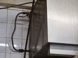 an image of a kitchen with a stove and a microwave
