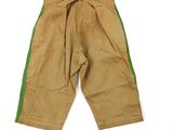 an old pair of brown pants with green trims on a white surface