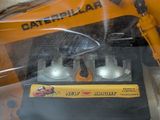 a toy excavator that is in a plastic box
