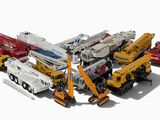 de nombreux types différents d'engins de chantier sur une surface blanche