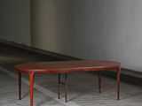 an image of a coffee table sitting on a wooden floor in a room